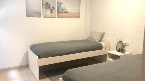 Ein Bett oder Betten in einem Zimmer der Unterkunft Piso Mirador Ses Cales 61 Calas de Mallorca