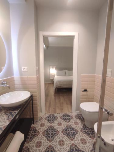 a bathroom with a sink and a toilet at Residenza Montebello in Ancona