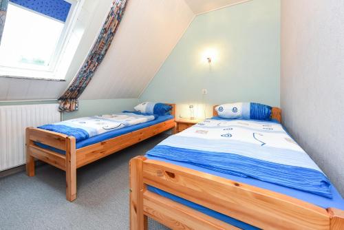Postel nebo postele na pokoji v ubytování Ferienhaus Elfriede Coordes