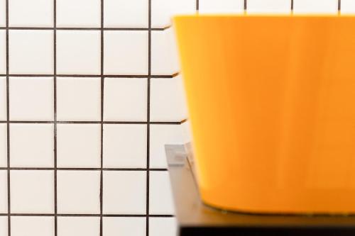 an orange cup sitting on top of a counter at The Snug Townhouse in Galway