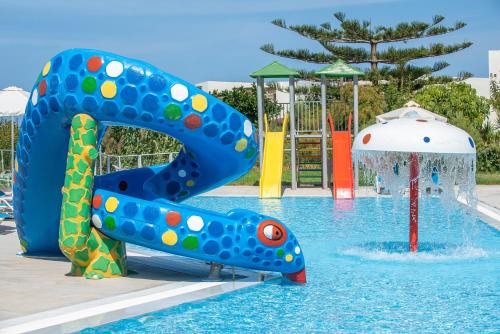 a splash park with a slide in a pool at Rethymno Mare Royal & Water Park in Skaleta