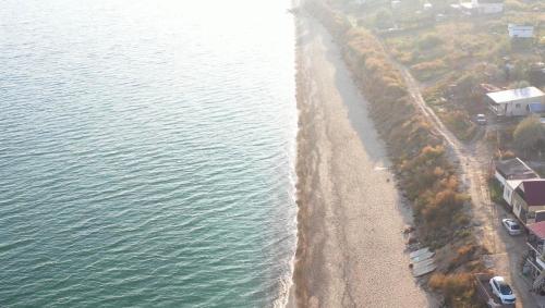 an aerial view of a beach next to the water at Mini-Hotel Luch in Odesa