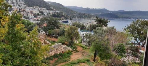 a view of a city and a body of water at YALI PANSİYON in Kas