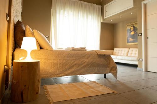 Ein Bett oder Betten in einem Zimmer der Unterkunft La MAISON DO' VILLA con possibilità di parcheggio privato interno