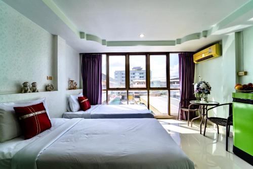 Ένα ή περισσότερα κρεβάτια σε δωμάτιο στο Mind and Punpun Apartment