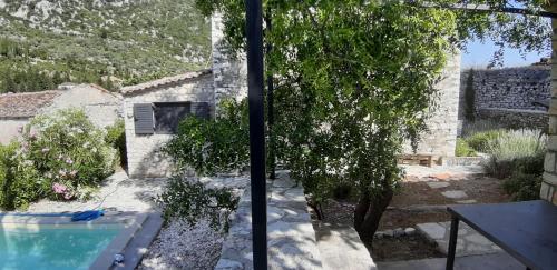 a view of a house with a swimming pool at Les Villas de Qeparo in Qeparo