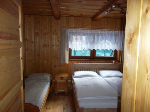 Tempat tidur dalam kamar di Chata Sipkova I