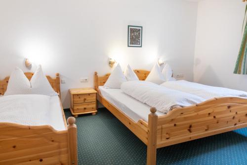 Postel nebo postele na pokoji v ubytování Appartmenthaus Bachler