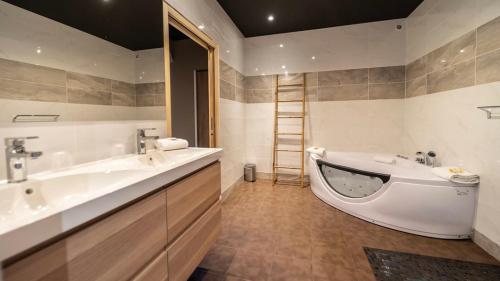 a bathroom with two sinks and a bath tub at Palm Beach in Ajaccio
