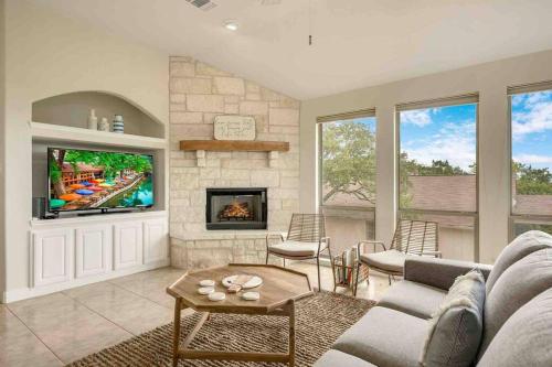 a living room with a couch and a fireplace at Canyon Lake Home with Breathtaking View in Canyon Lake