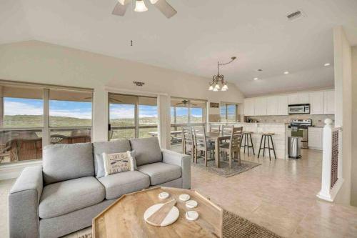 a living room with a couch and a table at Canyon Lake Home with Breathtaking View in Canyon Lake