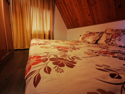 מיטה או מיטות בחדר ב-Vila Eva