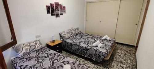 เตียงในห้องที่ Apartamento Centro , Playa Costa Brava y Barcelona