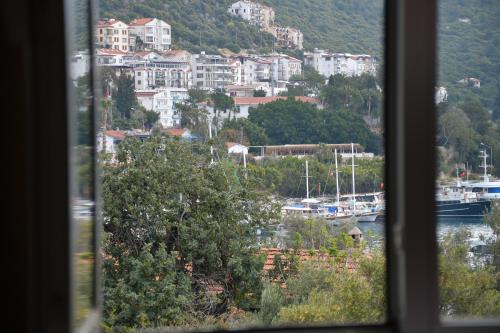 a view from a window of a harbor with boats at YALI PANSİYON in Kas