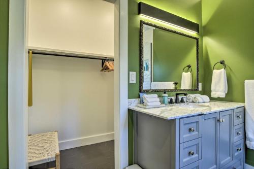 a bathroom with a sink and a mirror at Renovated Carrboro House with Deck and Fire Pit! in Carrboro