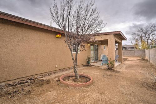 a tree in a pot in front of a house at Kid-Friendly Kingman Home Near Parks and Dining in Kingman