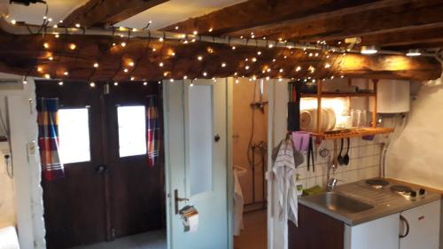 a kitchen with christmas lights hanging from a ceiling at Villa Appetite in Marmarion
