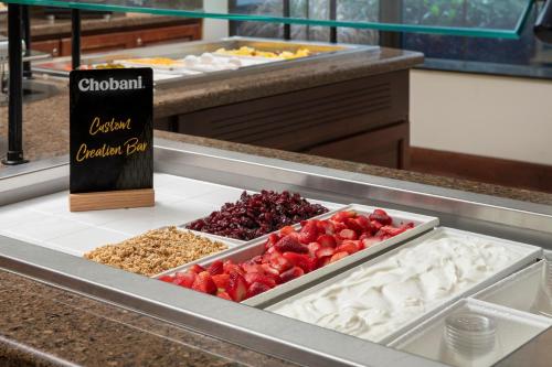 a buffet line with different types of food at Staybridge Suites North Charleston by IHG in Charleston