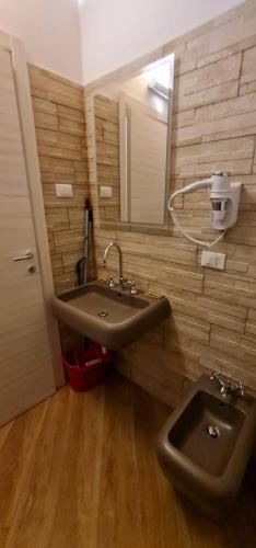 a bathroom with a sink and a mirror at IL MASCHERONE in Sepino