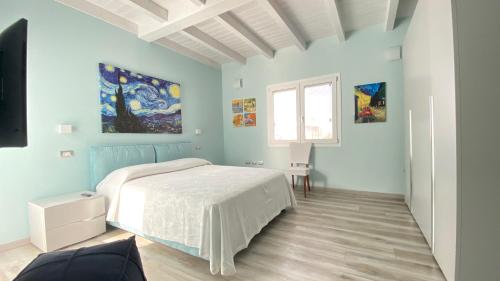 Postel nebo postele na pokoji v ubytování B&B Luce Cagliari