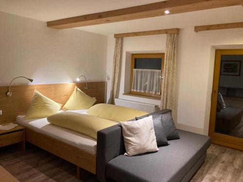 Кровать или кровати в номере Haus Holzer