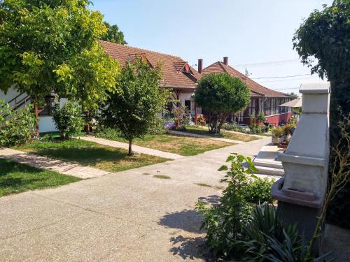 a street of houses with trees and a sidewalk at Remser Haus in Zalakaros