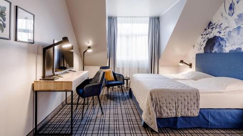 Una cama o camas en una habitación de Hotel Ambiente