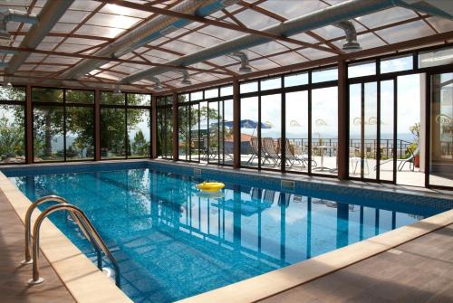 a swimming pool with a view of the ocean at Park Hotel Arbanassi in Arbanasi