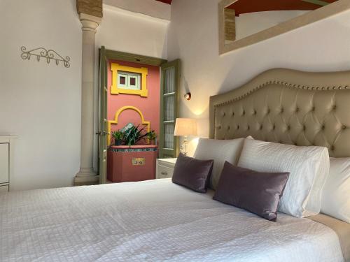 Posteľ alebo postele v izbe v ubytovaní Casa Boutique Eros