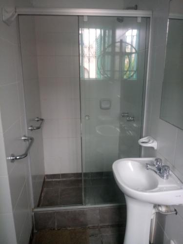 a bathroom with a shower and a toilet and a sink at La Casona Azul in Lima