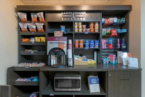 a counter in a store with a microwave at Candlewood Suites Reading by IHG in Reading