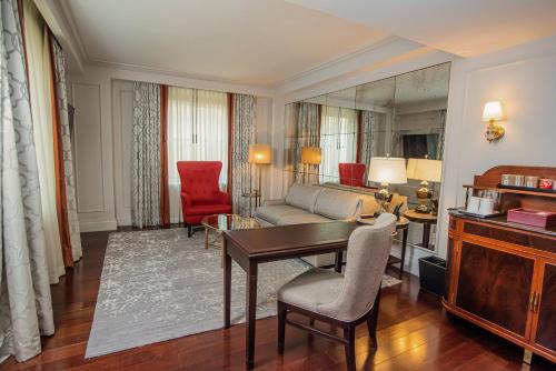 a living room with a table and a couch at InterContinental New York Barclay Hotel by IHG in New York