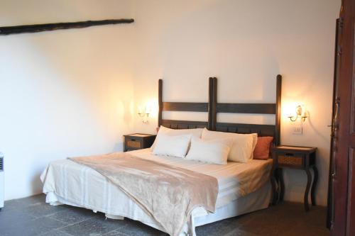 En eller flere senge i et værelse på Finca Mariola - Centenaria