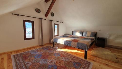 a bedroom with a bed and a rug at Bran Hill in Bran