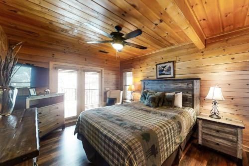 a bedroom with a bed and a ceiling fan at Inspiration Point in Dupont Springs