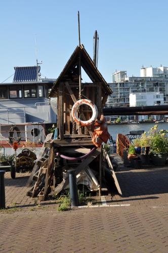 a small wooden bird house with a life preserver on it at Eastendroom in Amsterdam