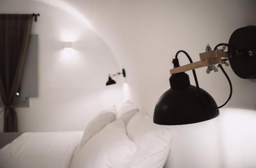 Bianco Diverso Suitesにあるベッド