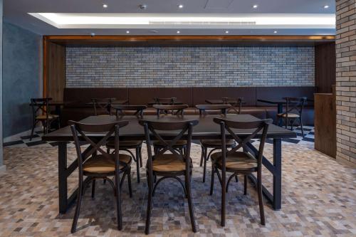 a dining room with a table and chairs at Radisson Resort Ras Al Khaimah Marjan Island in Ras al Khaimah