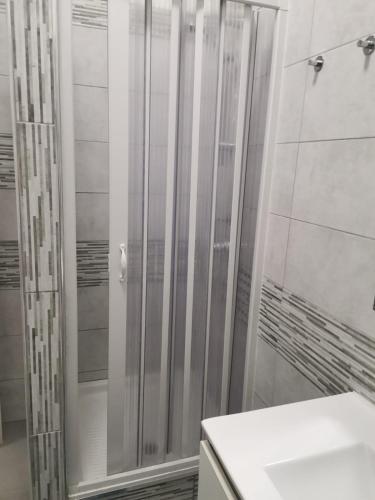 a bathroom with a shower and a sink at BED&FLY NEAR AIRPORT CATANIA FONTANAROSSA BAGNO PRIVATO In CAMERA in Catania