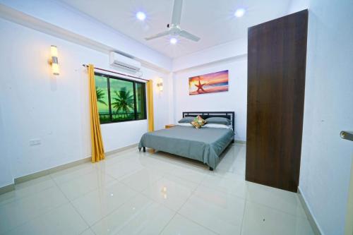 Postel nebo postele na pokoji v ubytování Coastal Suites Fiji
