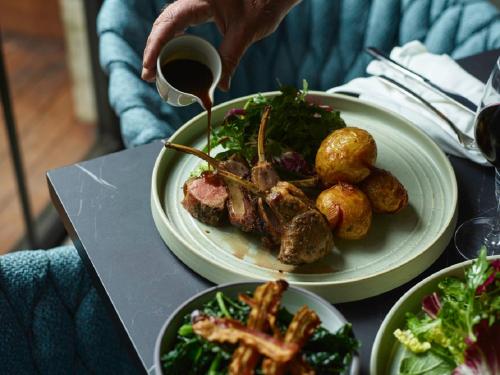 a table with two plates of food on it at Kyah in Blackheath