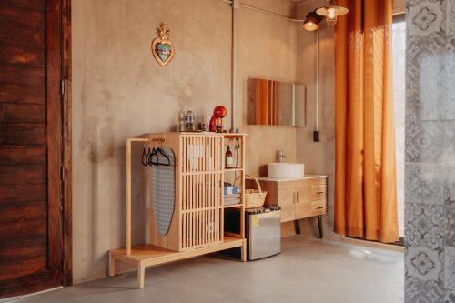 a bathroom with a mirror on a shelf in a room at The Pangea Valle de Guadalupe in Valle de Guadalupe