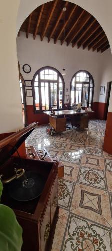 a large room with a pool table in the middle at San Felipe el Real in Chihuahua