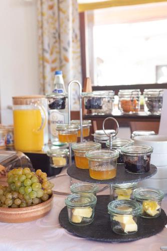 a table topped with different types of food and drinks at Fiastyúk Udvarház in Csór