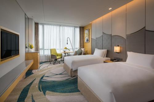 Postel nebo postele na pokoji v ubytování Holiday Inn Suzhou Taihu Lake by IHG