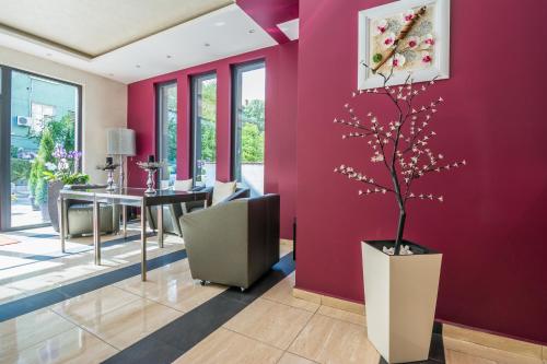 Uma área de estar em Hotel Calipso Hotel