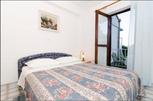 Postel nebo postele na pokoji v ubytování Apartments Maruška