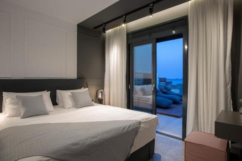 A bed or beds in a room at High-end Villa Faos Two