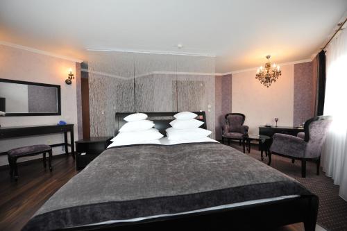 Posteľ alebo postele v izbe v ubytovaní Hotel Linder