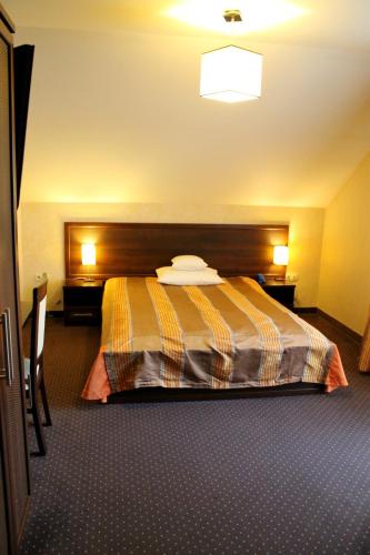 Ένα ή περισσότερα κρεβάτια σε δωμάτιο στο Hotel Linder